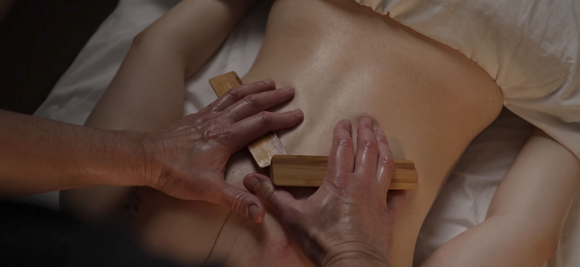 Warm bamboo massage at Bloor West Retreat in Toronto to relieve tension and promote relaxation