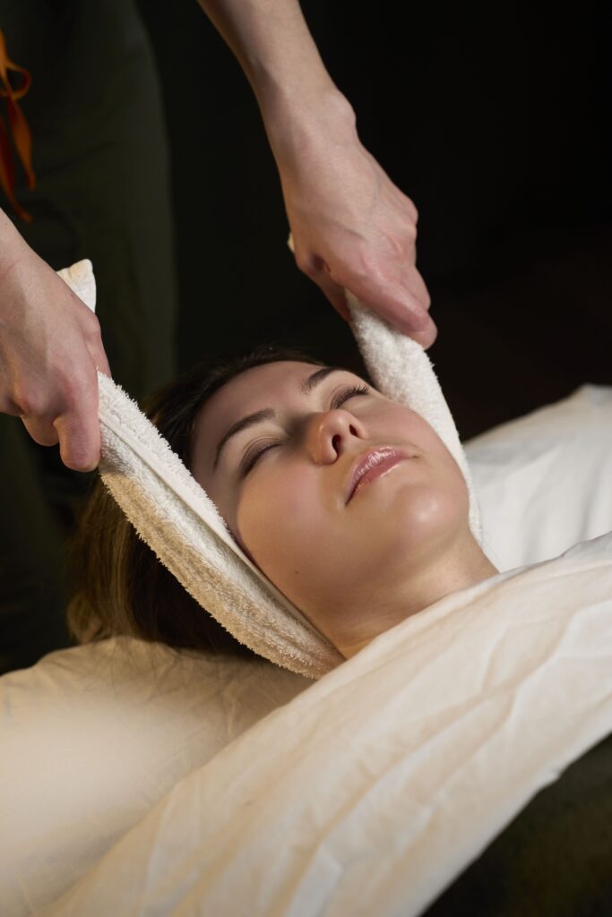 Therapist performing a deep tissue massage to relieve muscle tension at Bloor West Retreat