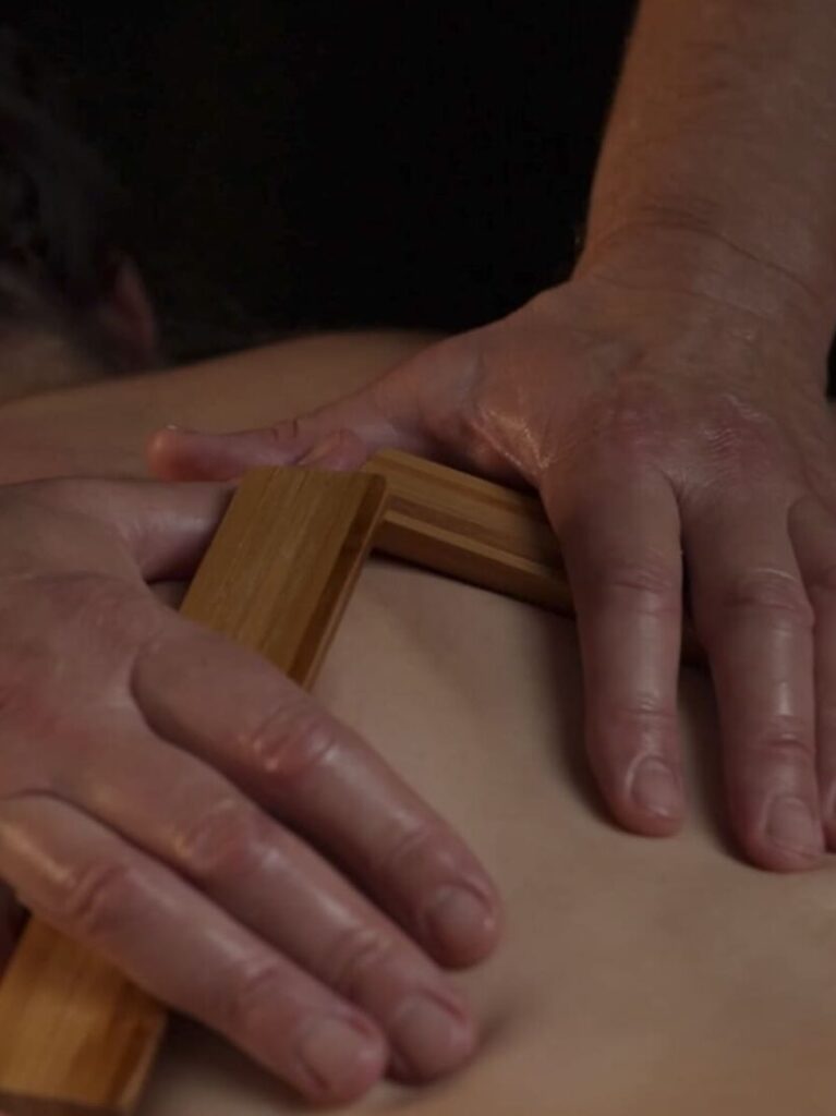 Relaxing warm bamboo massage for muscle tension relief in Toronto spa